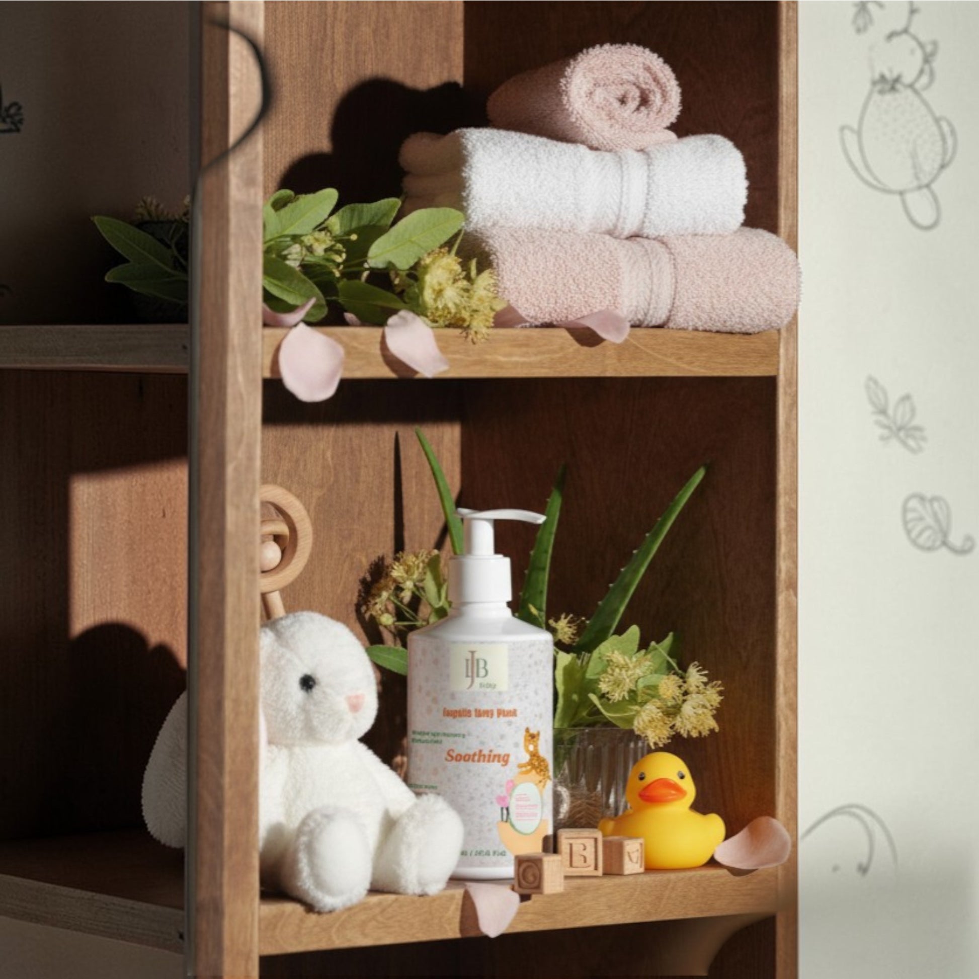 Wooden shelf with baby products including a bottle, plush toy, and rubber duck.