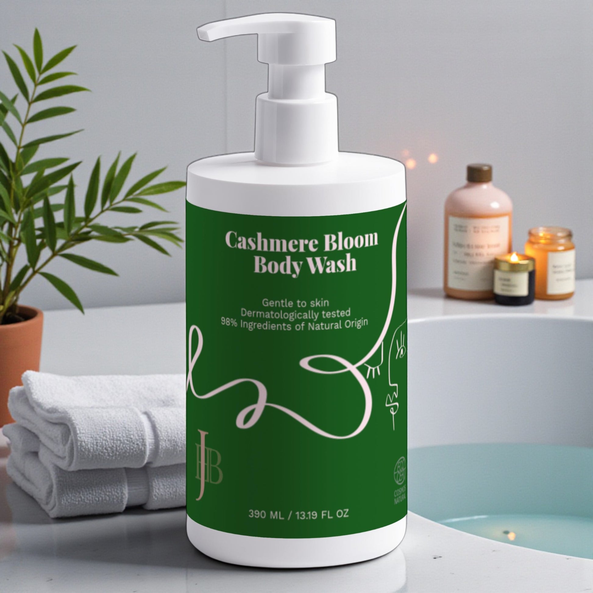 Cashmere Bloom Body Wash bottle on a bathroom counter with towels and candles in the background