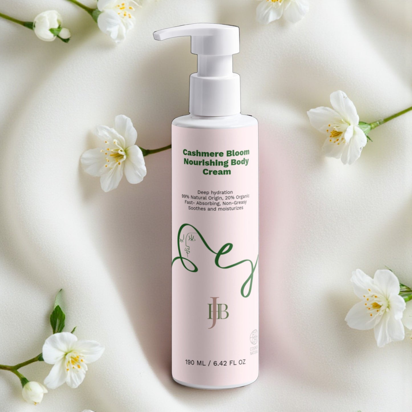 Pink bottle of Cashmere Bloom Nourishing Body Cream with white flowers on a light background