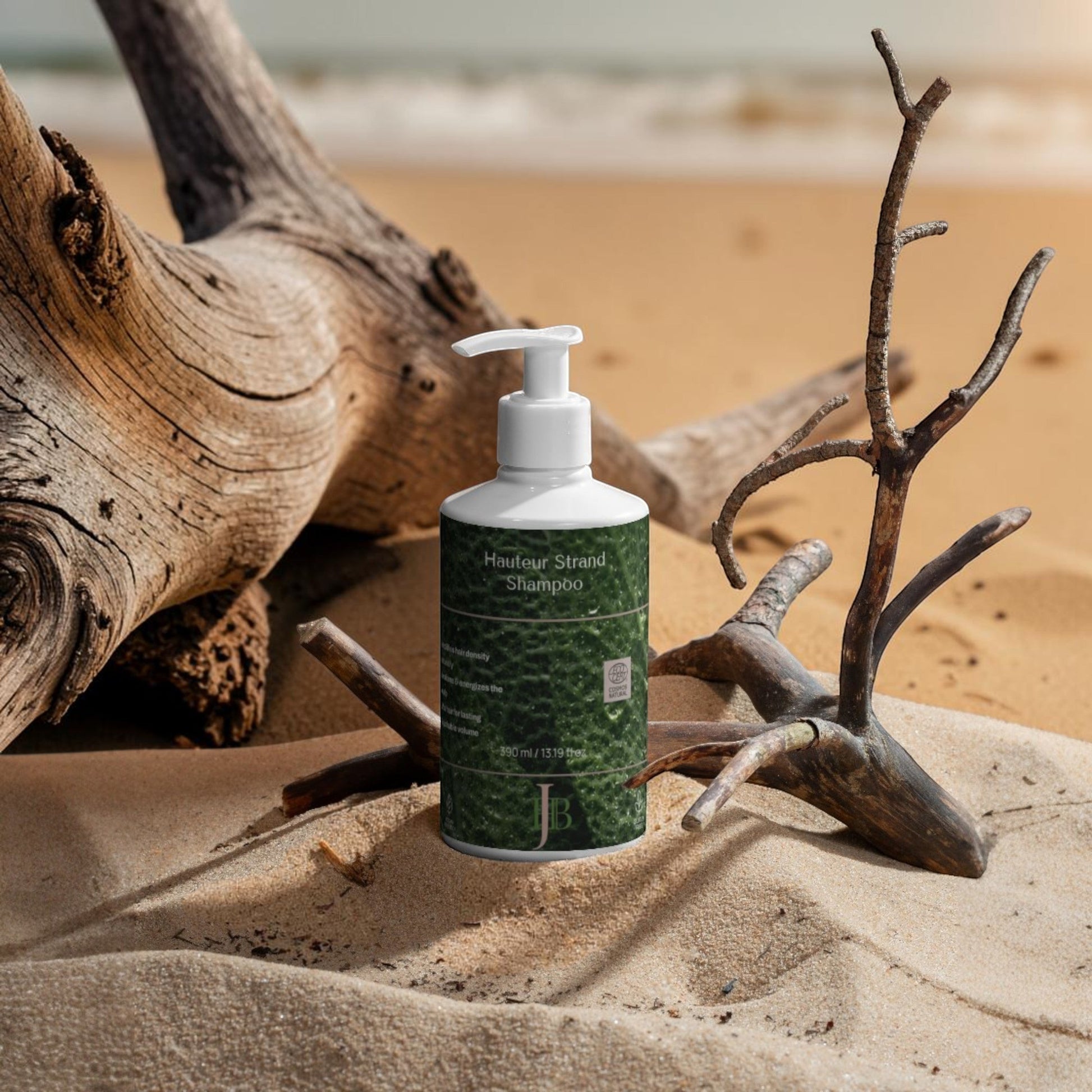 Shampoo bottle on sand with driftwood and beach background