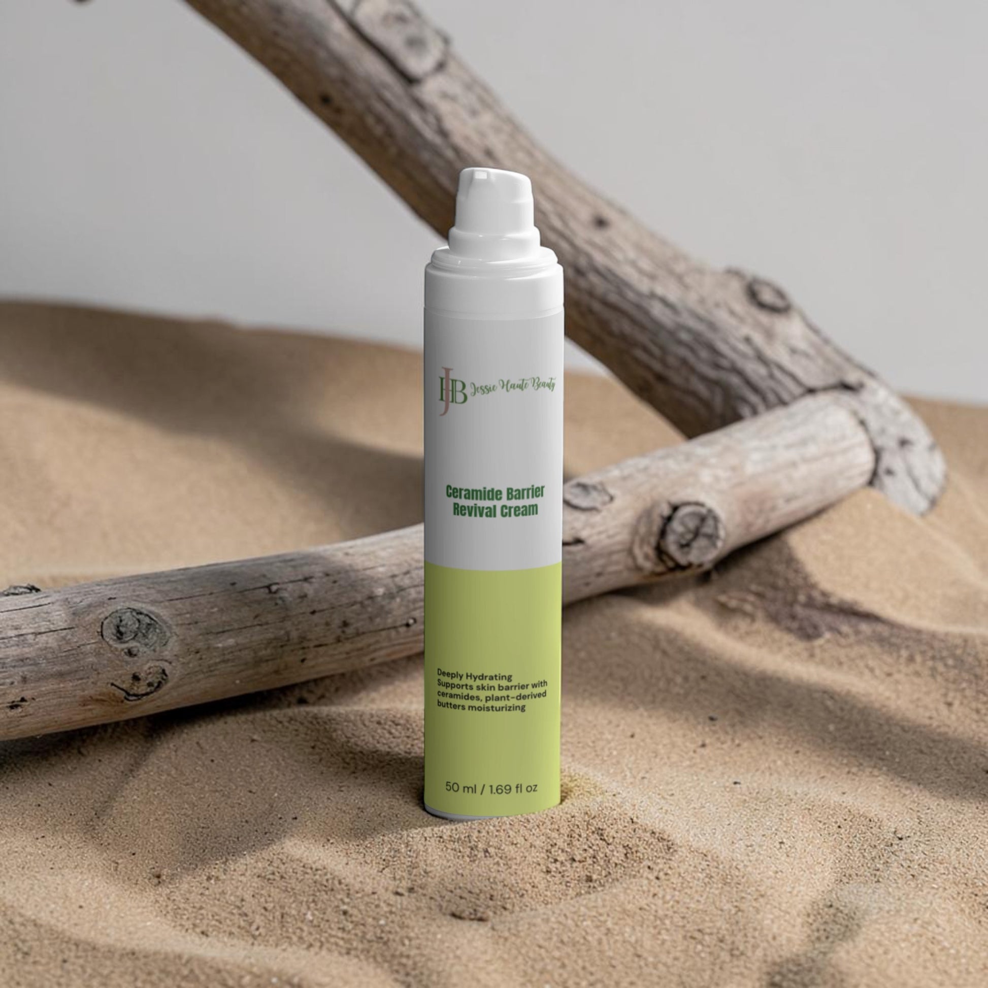 Skincare product bottle on sand with driftwood