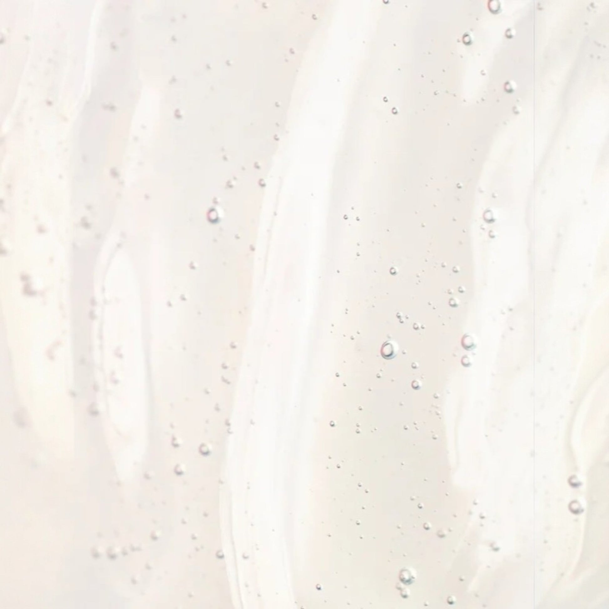 Close-up of a textured white surface with small specks