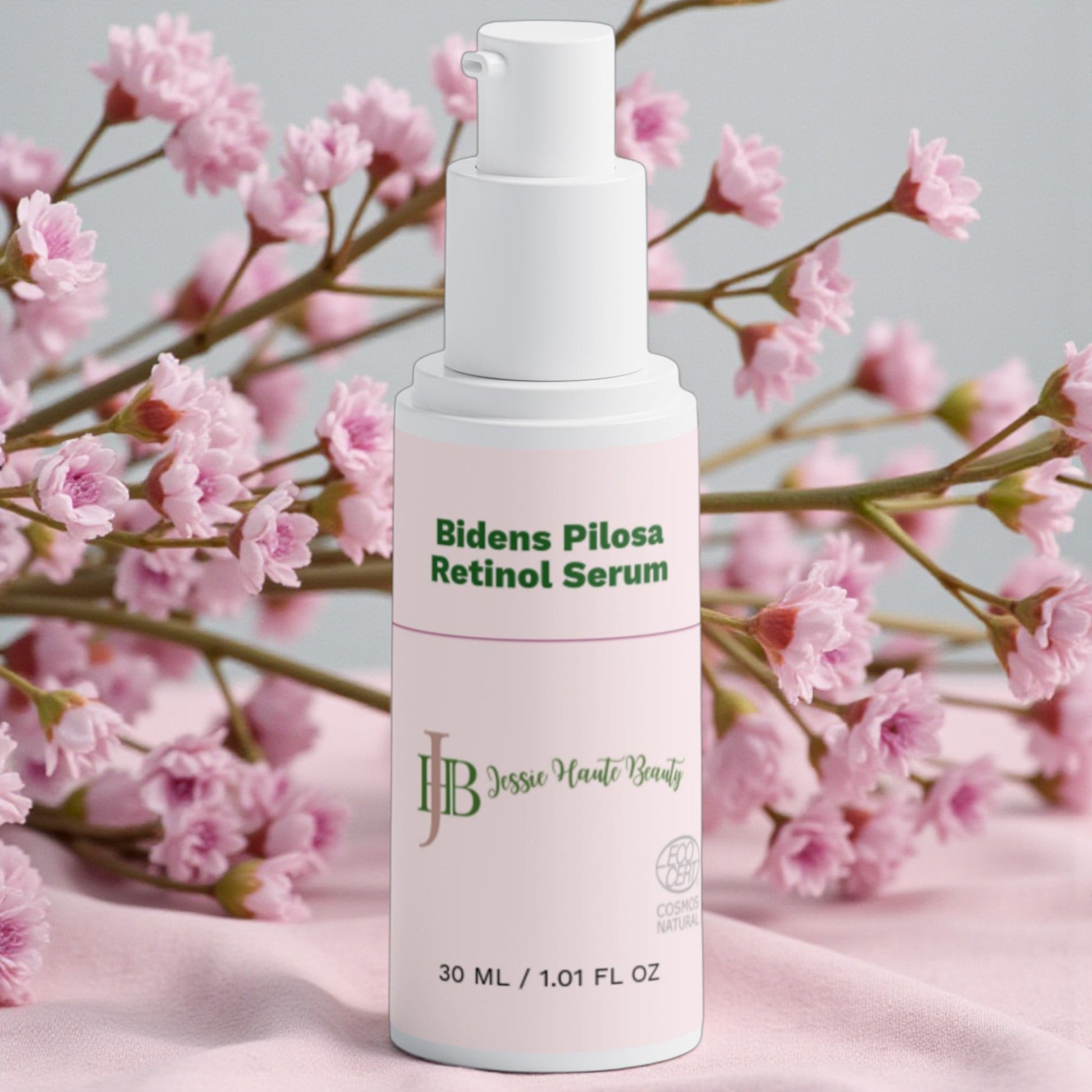 Jessie haute beauty Bidens Pilosa Retinol Serum bottle with pink flowers in the background